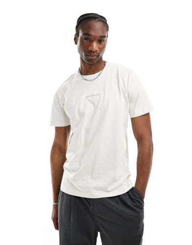 T-shirt à logo monogramme - Blanc ivoire - Calvin Klein Jeans - Modalova
