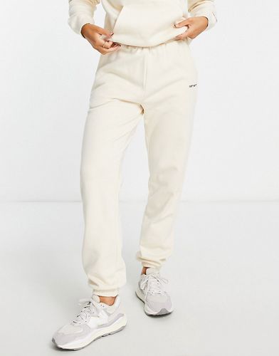Pantalon de jogging d'ensemble décontracté avec petit logo - Crème - Carhartt Wip - Modalova