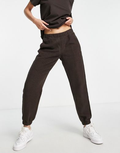 Luxe Lounge - Pantalon de jogging en polaire - foncé - Adidas Originals - Modalova