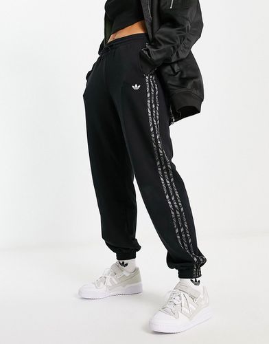 Pantalon de jogging avec trois bandes à imprimé zébrures abstrait - Adidas Originals - Modalova