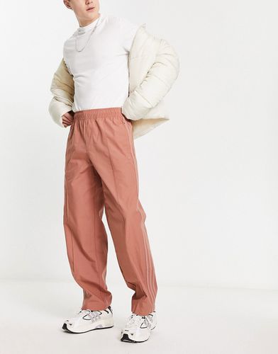 Pantalon fuselé à logo - Terre battue - Adidas Originals - Modalova