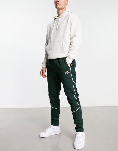 Adidas Sportswear - Pantalon de jogging à passepoil réfléchissant - foncé - adidas performance - Modalova
