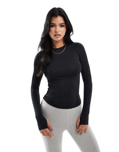 Icon - Top de sport ajusté à manches longues - Asos 4505 - Modalova