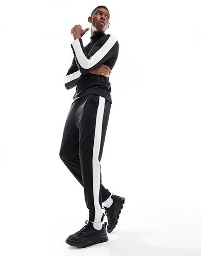Pantalon de jogging slim avec bande latérale contrastante - Asos 4505 - Modalova