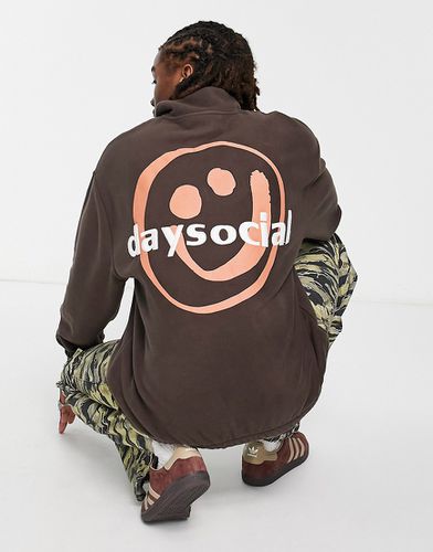 ASOS Daysocial - Sweat oversize en polaire à fermeture éclair partielle et grand imprimé smiley au dos - Asos Design - Modalova