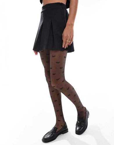 Collants plumetis à motif nauds - Asos Design - Modalova