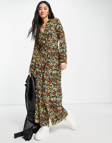 Combinaison rétro style années 70 en crêpe texturé avec col et ceinture à imprimé fleurs - Jaune moutarde - Asos Design - Modalova