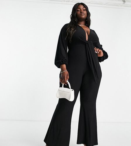 ASOS DESIGN Curve - Combinaison glamour près du corps à décolleté plongeant avec naud à l'avant - Asos Curve - Modalova