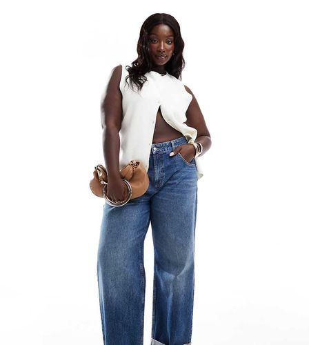 ASOS DESIGN Curve - Jean boyfriend baggy à taille mi-haute et ourlets retroussés - moyen - Asos Curve - Modalova