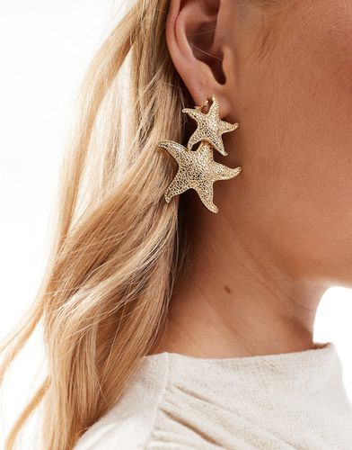Boucles d'oreilles avec pendant heurtoir à étoiles de mer - Asos Design - Modalova