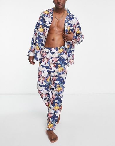 Ensemble de pyjama avec chemise à manches longues et pantalon à imprimé fleurs - Asos Design - Modalova