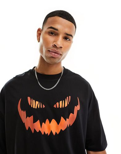 Halloween - T-shirt oversize avec imprimé visage en citrouille - Asos Design - Modalova