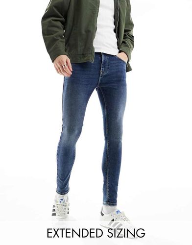 Jean seconde peau en tissu power stretch - délavé foncé - Asos Design - Modalova