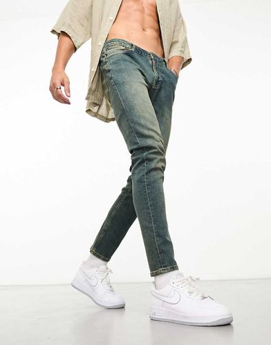 Jean skinny style années 2000 - délavé moyen - Asos Design - Modalova