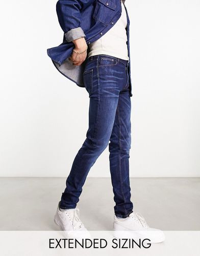 Jean skinny style années 2000 - foncé délavé - Asos Design - Modalova