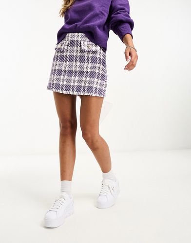 Mini-jupe en bouclé avec boutons et carreaux - Lilas - Asos Design - Modalova