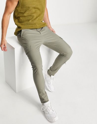 Pantalon cargo effet seconde peau à poches multiples - Kaki clair - Asos Design - Modalova