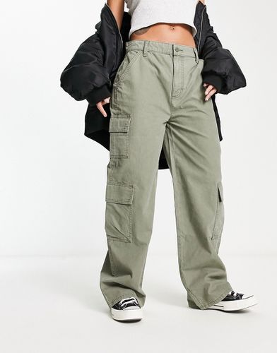 Pantalon cargo oversize avec plusieurs poches - Kaki - Asos Design - Modalova