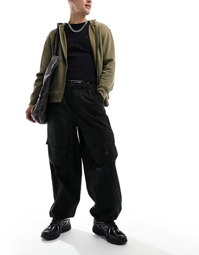Pantalon ample avec poches cargo élastiques devant - Asos Design - Modalova