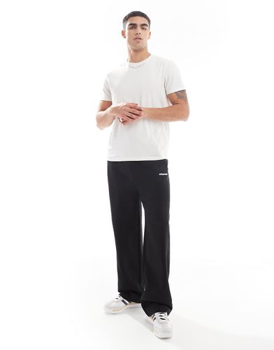 Pantalon de jogging ample à fermeture éclair et imprimé - Asos Design - Modalova