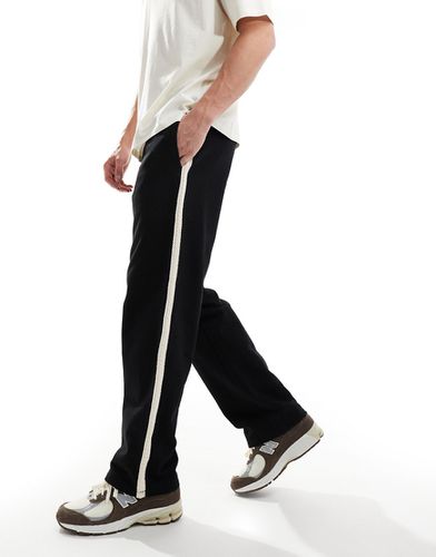 Pantalon de jogging ample avec bande latérale - Asos Design - Modalova