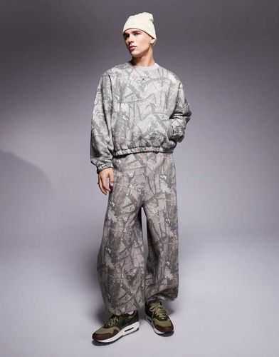 Pantalon de jogging d'ensemble coupe ballon oversize à imprimé camouflage - Asos Design - Modalova