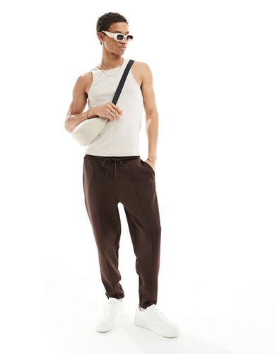 Pantalon de jogging fuselé en néoprène - Marron - Asos Design - Modalova