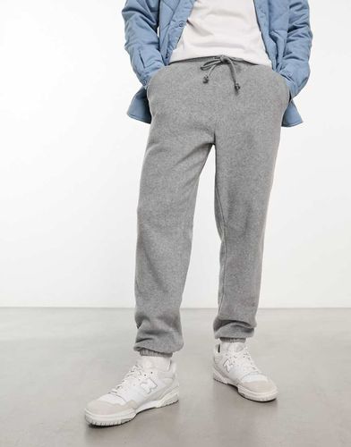 Pantalon de jogging fuselé en polaire - Asos Design - Modalova