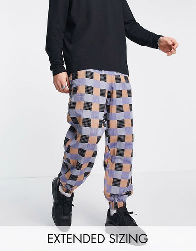 Pantalon fuselé oversize effet patchwork - Asos Design - Modalova