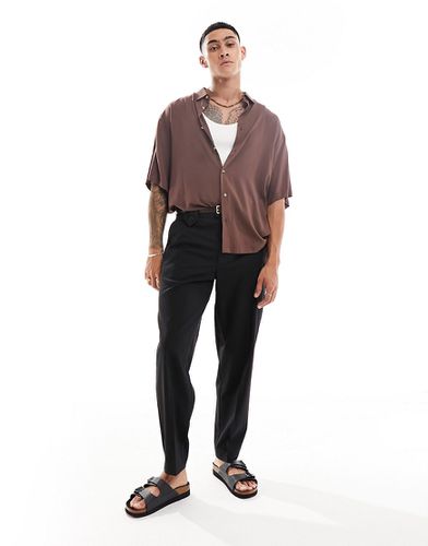 Pantalon habillé coupe oversize fuselée avec boutonnage - Asos Design - Modalova