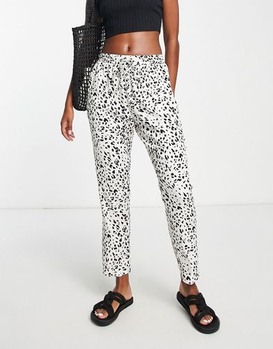 Pantalon style jogger resserré aux chevilles - Imprimé animal - Asos Design - Modalova