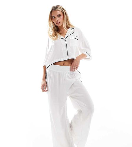 ASOS DESIGN Petite - Pantalon de pyjama souple près du corps et ultra doux à liserés contrastants - Asos Petite - Modalova