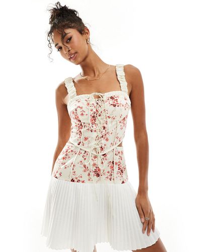 Robe courte corset en sergé à fleurs roses avec laçage et jupe plissée - Asos Design - Modalova