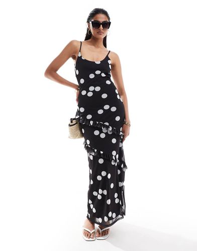 Robe longue à volants et bretelles nouée dans le dos - Noir à pois blancs - Asos Design - Modalova