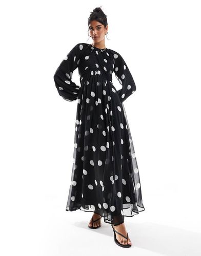 Robe longue à pois avec corsage effet croisé et manches bouffantes - Noir - Asos Design - Modalova