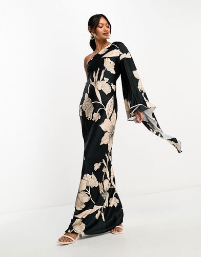 Robe longue asymétrique en satin à manche unique évasée et détail au dos - Noir à imprimé fleurs - Asos Design - Modalova