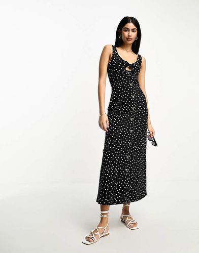 Robe sans manches mi-longue à pois avec boutons et liens - Asos Design - Modalova