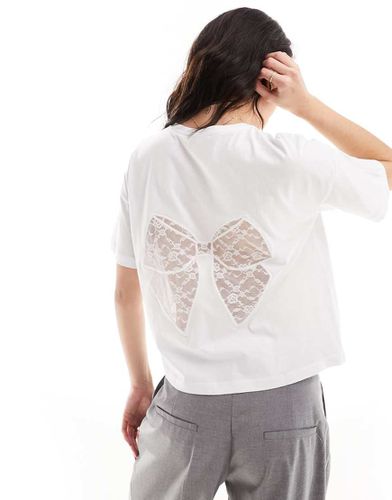 T-shirt oversize avec naud en dentelle dans le dos - Asos Design - Modalova