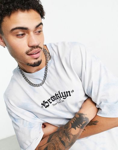 T-shirt oversize avec imprimé texte style gothique sur le devant - délavé - Asos Design - Modalova