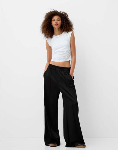 Pantalon de survêtement large à liserés - Bershka - Modalova