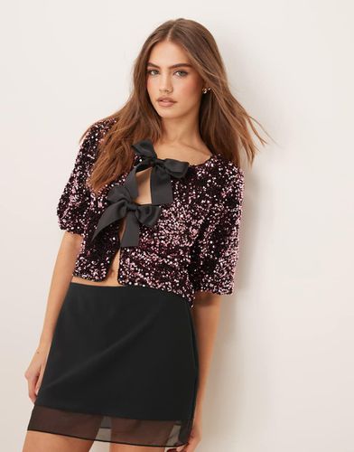 Top à sequins avec manches courtes et nauds en satin - Gina Tricot - Modalova