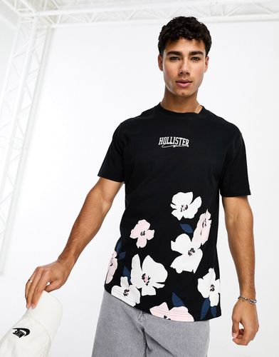 T-shirt avec logo au centre et imprimé fleurs de cerisier - Hollister - Modalova