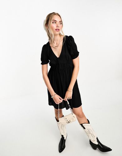 Robe babydoll courte à manches bouffantes - Monki - Modalova