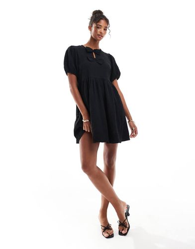 Robe babydoll courte avec naud sur le devant - New Look - Modalova