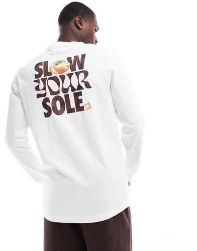 T-shirt à manches longues et imprimé Slow Your Sole » - Nike - Modalova