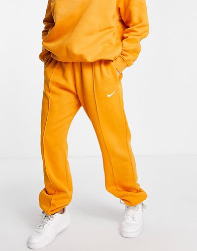 Joggers oversize avec mini logo virgule - Orange - Nike - Modalova