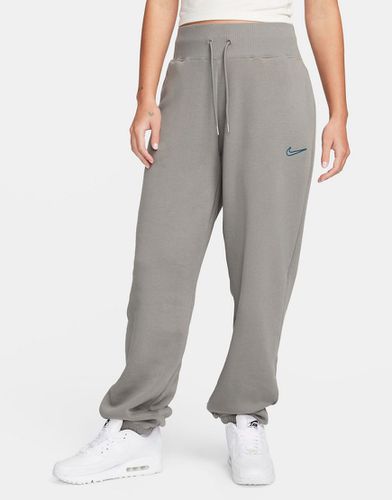 Pantalon de jogging unisexe avec logo virgule moyen - foncé - Nike - Modalova