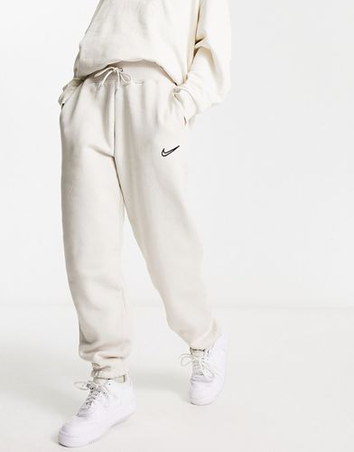 Phoenix - Pantalon de jogging en polaire avec logo virgule - Marron minerai clair - Nike - Modalova