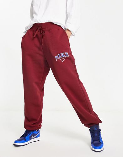 Phoenix - Pantalon de jogging unisexe style universitaire en polaire - campus - Nike - Modalova