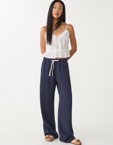 Pantalon large en lyocell - Bleu fonc - Stradivarius - Modalova